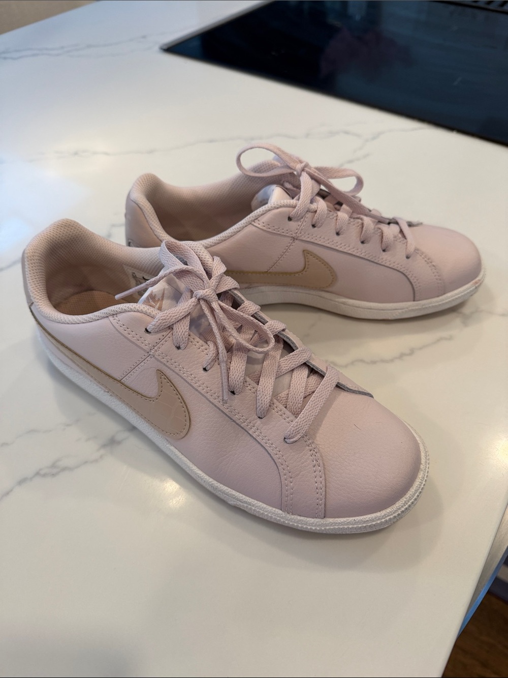 Nike Women’s Light Pink Leather Low-Top Sneakers with Beige Swoosh